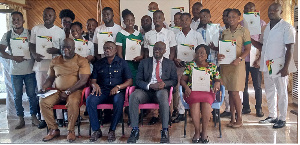 Officials in a pose with awardees