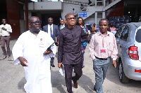 Mr Kenneth Ashigbey and Mr Boadu-Ayeboafoh leading Mr Abdul-Hamid on his tour