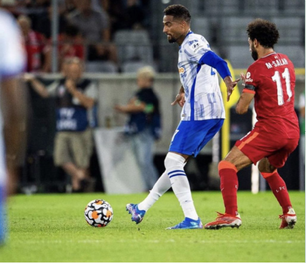 Kevin Prince Boateng wards off Salah during the game