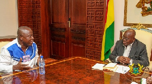 National Chairman of the GPRTU, Kwame Kuma interacts with President Akufo-Addo.