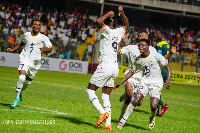 Michael Ephson and his teammates celebrating the winning goal