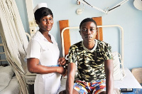 Afelete Apawu with a nurse at the hospital