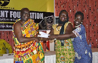 Ehunabobrim Prah Agyensaim VI (left) hands over cement allocation letter to beneficiary institution