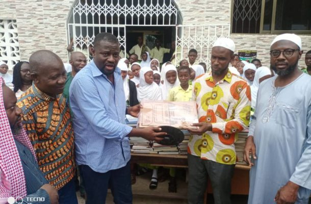 MP Frank Annoh-Dompreh (middle) makes the donation to a local school