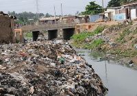 The choked and stench emitting gutters behind the Tema Metropolitan Assembly Headquarters