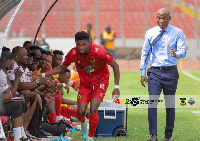 Propser Narteh watches on as Etouga Mbella celebrate with Kotoko bench