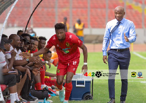 Propser Narteh watches on as Etouga Mbella celebrate with Kotoko bench