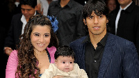 Man City record goal scorer Aguero with im wife and pikin