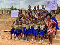 The teacher, Madina Adumtwumwa Asare with some of the students