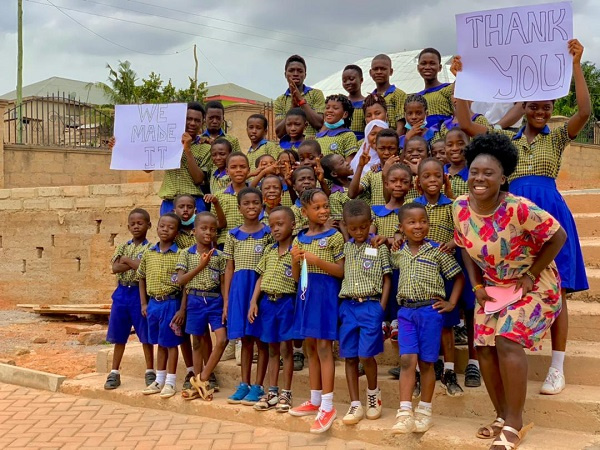 The teacher, Madina Adumtwumwa Asare with some of the students