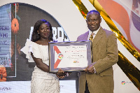 Linda Boateng [L], Communication &Online Executive at Agrihouse Foundation, receiving the award