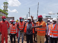 Kwesi Amoako Atta with the road engineers