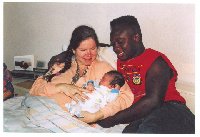 A photo of baby Memphis Depay, his father and mother