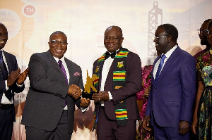 Mr. Joshua Mortoti presenting the award to Mr. Daniel Egya-Mensah