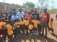 Volunteers from the foundation presenting the items to the school