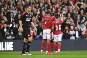 Albert Adomah joined by his teammates after scoring