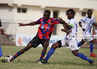 Jackson Owusu(in white) battles Legon Cities player  Credit: 442and Stock