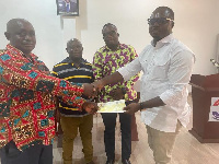 Francis Owusu Akyaw submitting his bank draft at the party office in Juaben