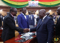 Speaker of Parliament Alban Bagbin in a handshake with President Akufo-Addo