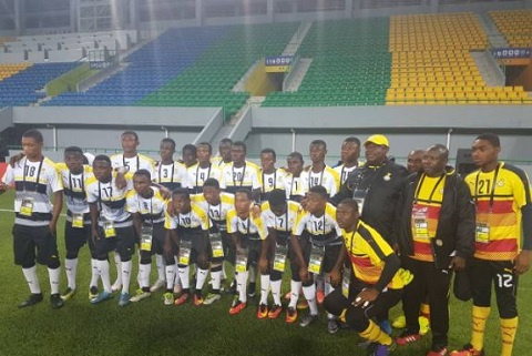 Paa Kwesi Fabin [black] with his team