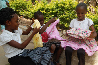 Children admiring their Christmas dresses