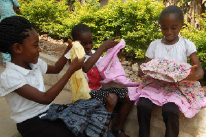 Children admiring their Christmas dresses