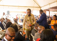 Joseph Boahen Aidoo, distributes chocolates to staff at 2020 National Chocolate Day variety show