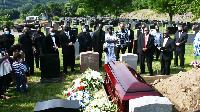 Some mourners at the cemetery