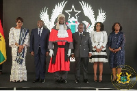 The Chief Justice flanked by the president, vice president, his predecessors and Attorney General