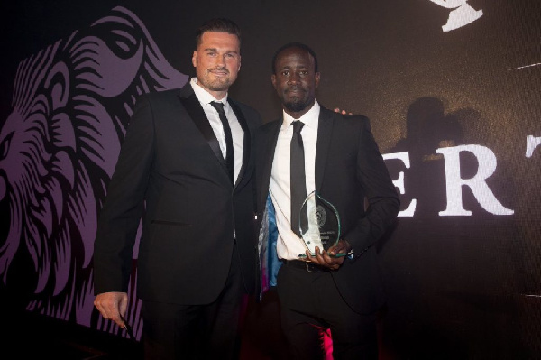 Albert Adomah (right) with his award