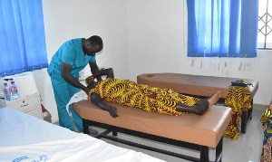 An elderly woman pictured undergoing medical screening