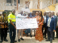 Rita Akosua Dickson receiving the cheque