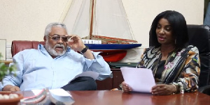 Former President Jerry John Rawlings [L] has lauded Bolton for his latest piece