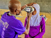 A pupil undergoing an eye screening test at the Busa Circuit