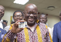 President Akufo-Addo holding his GhanaCard