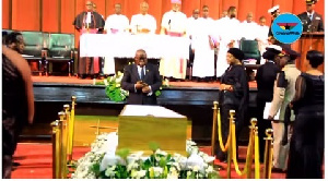 President Akufo-Addo paying his last respect to the late J. H. Mensah