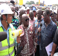 File photo, President Akufo Addo talking to Roads Minister, Kwasi Amoako Atta