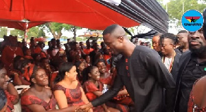 Happy Opoku-Kwarteng smile upon seeing Kwaku Manu and Sunsum take their turn to greet family members