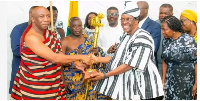 Speaker (second right) receiving the Suma Adinkra Sword