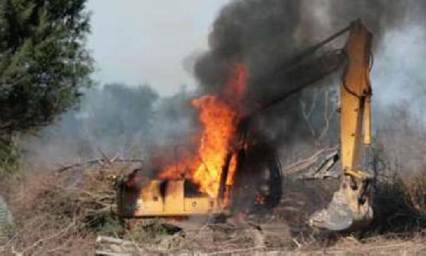 Screengrab of an excavator being burnt at a galamsey site