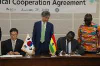 Deputy Minister of Energy Dr. Mohammed Amin Adam(R)  signing NPA agreement with K - Petrol