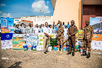 Founder of Osafric Ventures, Oscar Adu Sarfo presenting the items to officers at Nsawam Prison