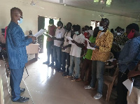 Moses Jotie swearing in the Unit Committees