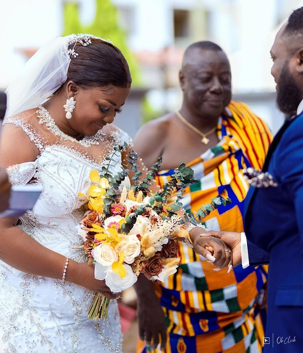 Tracey Boakye with her father and the groom