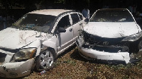 Some vehicles damaged by a police vehicle