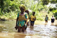 Some residents walking through to the river