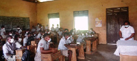 Madam Janet Atton interacting with pupils of the Bantama D.A JHS