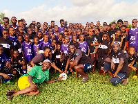 Robin Polley presented jerseys to young children