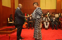 President Nana Addo Dankwa Akufo-Addo in a handshake with Otiko Afisa-Djaba