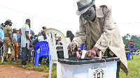 A man votes in Lubaga Division, Kampala